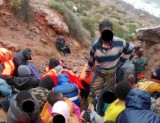 Armed forces supply food and blankets to 57 migrants stranded on tiny island